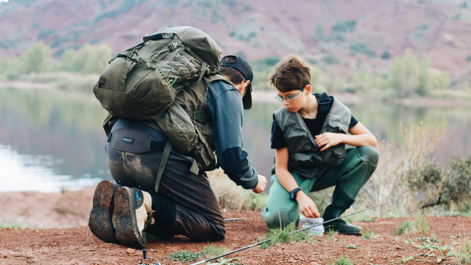 father and son wearing fishing clothing